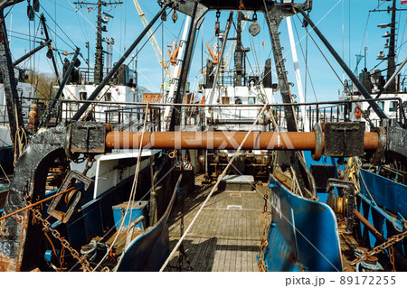 Fishing with a trawl. A large trawl with fish was dragged onto the deck of the ship. 89172255