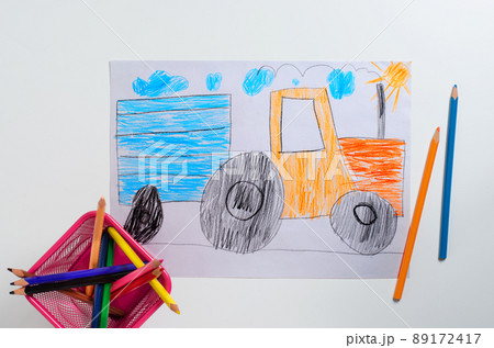 Drawing made by a child. Tractor with big wheels. Color pencils Drawing made by a child. Tractor with big wheels. Color pencils 89172417