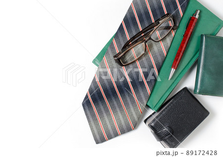 Men's accessories. Tie, green notebook, glasses, purse, business 89172428