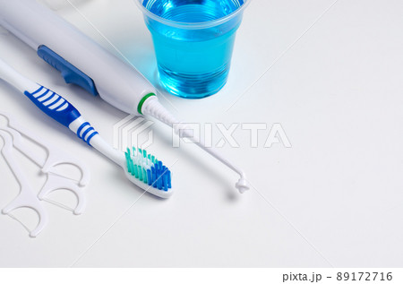 Dental oral irrigator, toothbrush, dental floss, mouthwash. On a white background 89172716