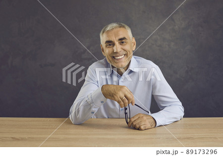 Happy man sit at desk speak on video call online 89173296