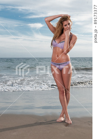 woman in bikini at the beach in spring or summer 89173377