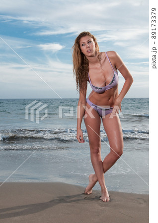 woman in bikini at the beach in spring or summer 89173379