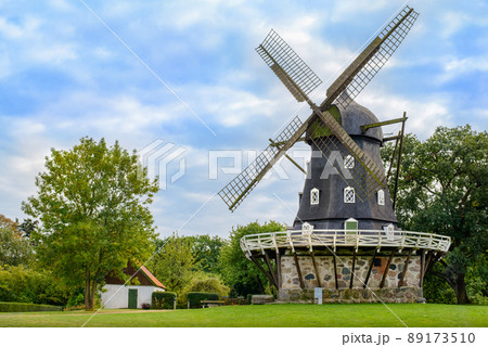 View of Old Windmill 'Slottsmollan' in the Kungsparken Park with beautiful clouds in the sky in Malmo, Sweden View of Old Windmill 'Slottsmollan' in the Kungsparken Park with beautiful clouds in the sky in Malmo, Sweden 89173510