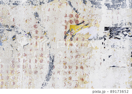 Dirty damaged concrete wall, remnants of paint and stains. Urban background 89173652