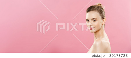 Skin Care Concept - Charming young caucasian woman with perfect makeup photo composition of brunette girl. Isolated on pink background with Copy Space. Skin Care Concept - Charming young caucasian woman with perfect makeup photo composition of brunette girl. Isolated on pink background with Copy Space. 89173728