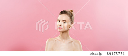 Skin Care Concept - Charming young caucasian woman with perfect makeup photo composition of brunette girl. Isolated on pink background with Copy Space. 89173771