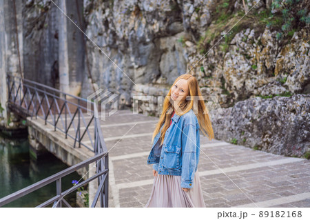 Woman tourist enjoying Colorful street in Old town of Kotor on a sunny day, Montenegro. Travel to Montenegro concept Woman tourist enjoying Colorful street in Old town of Kotor on a sunny day, Montenegro. Travel to Montenegro concept 89182168