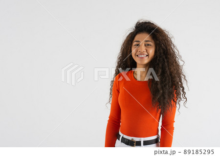 Young woman standing looking at camera with copy space 89185295