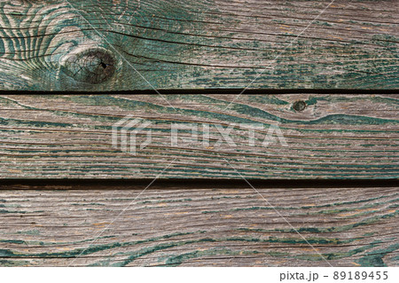 Wooden background, old wooden wall, painted blue, with slits and nails 89189455