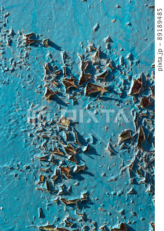 Blue peeling paint on the wall. Old concrete wall with cracked flaking paint. Weathered rough painted surface with patterns of cracks and peeling. High resolution texture for background and design Blue peeling paint on the wall. Old concrete wall with cracked flaking paint. Weathered rough painted surface with patterns of cracks and peeling. High resolution texture for background and design 89189485