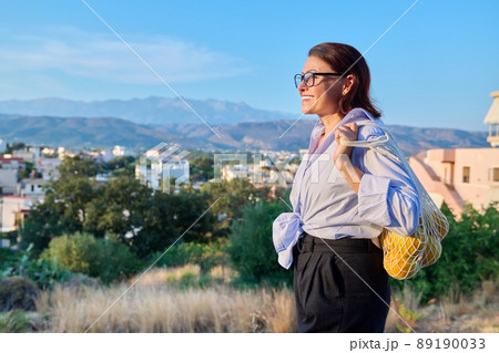Happy calm woman enjoying vacation in nature, profile view 89190033