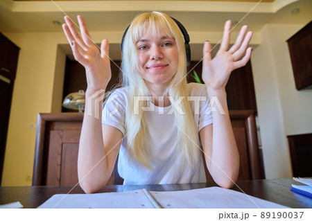 Teenage female student studying online at home 89190037