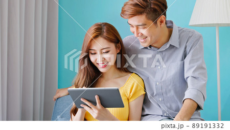 couple use tablet at home couple use tablet at home 89191332