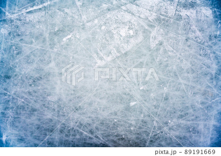 Ice background with marks from skating and hockey, blue texture of rink surface with scratches 89191669