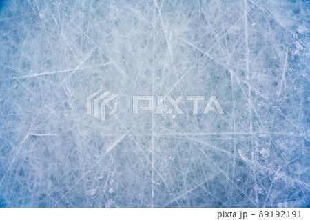 Ice background with marks from skating and hockey, blue texture of rink surface with scratches Ice background with marks from skating and hockey, blue texture of rink surface with scratches 89192191
