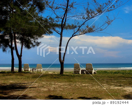 Tropical Beach Scene in Sabah Malaysian Borneo with Sun Loungers 89192444