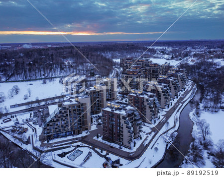 Aerial view of residental complex Novogorsk Olympic village in the evening at sunset. River like a border, beautiful view from the sky. . High quality photo 89192519