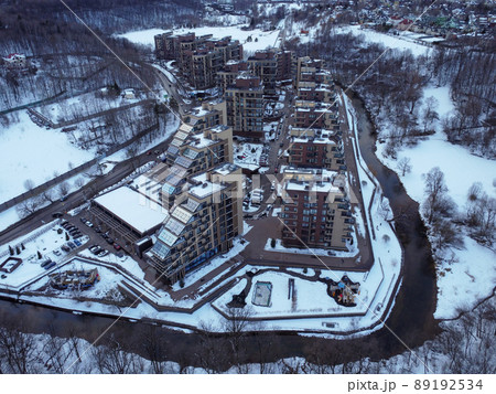Aerial view of residental complex Novogorsk Olympic village in the evening at sunset. River like a border, beautiful view from the sky. . High quality photo Aerial view of residental complex Novogorsk Olympic village in the evening at sunset. River like a border, beautiful view from the sky. . High quality photo 89192534