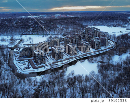 Aerial view of residental complex Novogorsk Olympic village in the evening at sunset. River like a border, beautiful view from the sky. . High quality photo 89192538