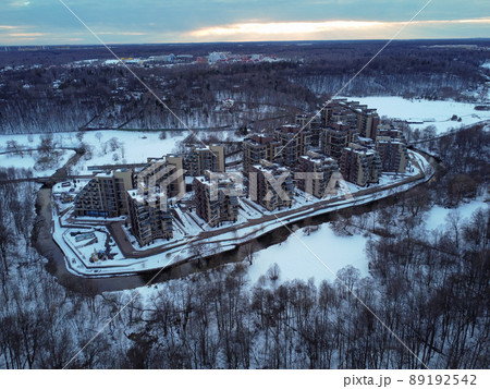 Aerial view of residental complex Novogorsk Olympic village in the evening at sunset. River like a border, beautiful view from the sky. . High quality photo Aerial view of residental complex Novogorsk Olympic village in the evening at sunset. River like a border, beautiful view from the sky. . High quality photo 89192542