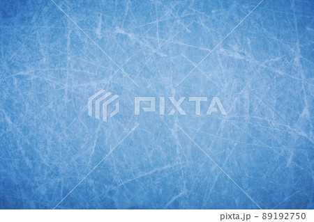 Ice background with marks from skating and hockey, blue texture of rink surface with many scratches 89192750