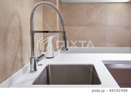 One bowl stainless steel kitchen sink and faucet in a modern style One bowl stainless steel kitchen sink and faucet in a modern style 89192996