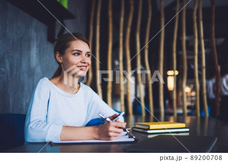 Charismatic businesswoman working in modern office 89200708