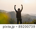 silhouette hiker man relax on mountain with sunset background 89200739