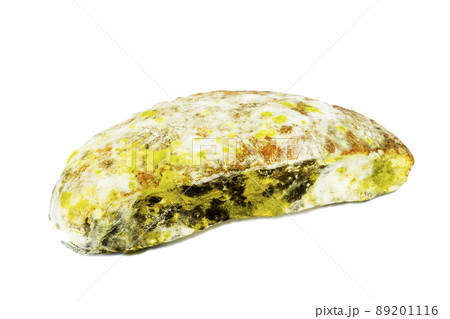 Mold on food. A mod for fluffy spores on bread. A piece of moldy bread on a white background. Mold on food. A mod for fluffy spores on bread. A piece of moldy bread on a white background. 89201116