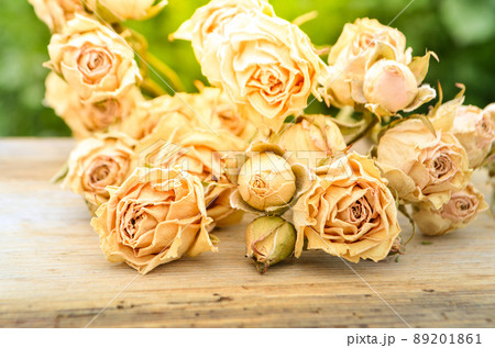 Withered rose on wood Withered rose on wood 89201861