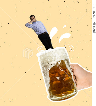 Contemporary art collage. Funny man jumping into cool foamy lager beer isolated over yellow background Contemporary art collage. Funny man jumping into cool foamy lager beer isolated over yellow background 89201903