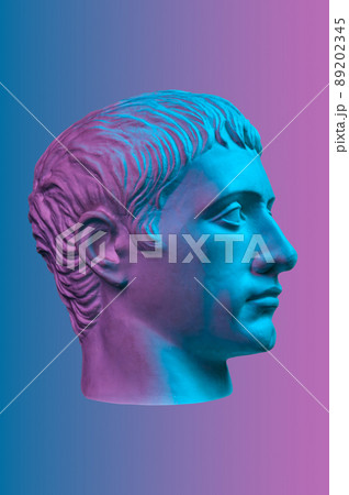 Blue purple gypsum copy of ancient statue of Germanicus Julius Caesar head for artists isolated on color background. Renaissance epoch. Plaster sculpture of man face. Template for art design 89202345