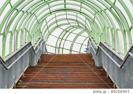Stairs to the metal and glass corridor above the highway. Stairs to the metal and glass corridor above the highway. 89206905