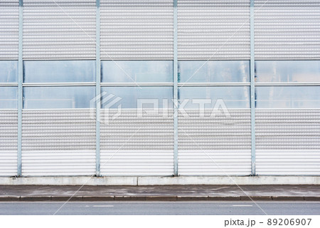 Part of the noise protection fence by the road. Part of the noise protection fence by the road. 89206907
