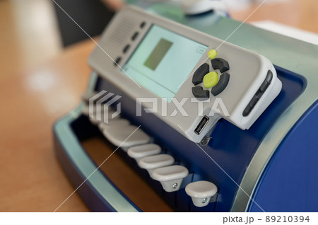 Close-up of a braille typewriter on a desktop.  89210394