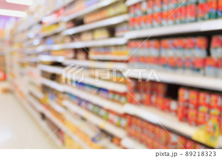 Canned food products in supermarket blurred background 89218323