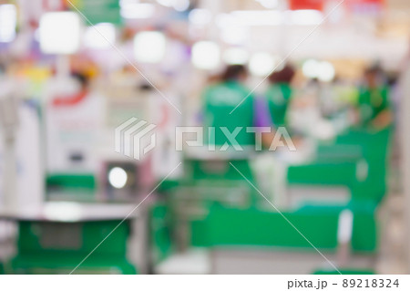 supermarket checkout payment terminal with customers blurred background 89218324