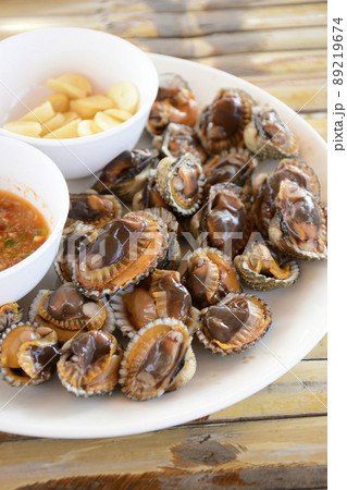 Parboiled cockles or bloody cockles with spicy Thai style dip sauce. Parboiled cockles or bloody cockles with spicy Thai style dip sauce. 89219674