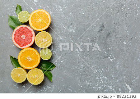 Fruit background. Colorful fresh fruits on colored table. Orange, lemon, grapefruit Space for text healthy concept. Flat lay, top view, copy space Fruit background. Colorful fresh fruits on colored table. Orange, lemon, grapefruit Space for text healthy concept. Flat lay, top view, copy space 89221392