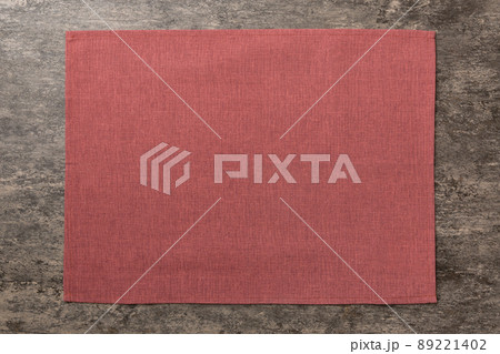 Top view of red tablecloth for food on cement background. Empty space for your design Top view of red tablecloth for food on cement background. Empty space for your design 89221402