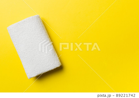 Top view of white towels with copy space on colored background 89221742