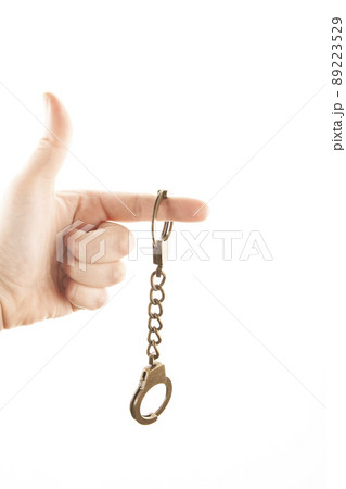 image of handcuffs hand white background  89223529