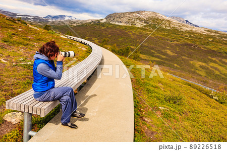 Woman on Vedahaugane rest stop, Norway 89226518