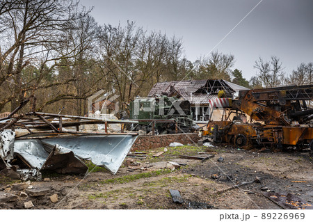 Irpin, Kyev region  Ukraine - 09.04.2022: Cities of Ukraine after the Russian occupation. Destroyed military equipment on the streets of the city. Lots of burnt and shelled vehicles. 89226969