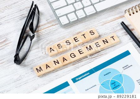 Asset management concept with letters on cubes 89229181