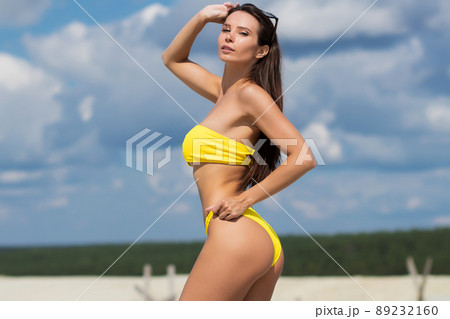 Beautiful woman in swimsuit on beach 89232160