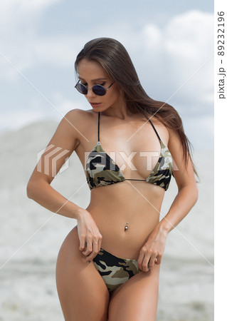 Beautiful woman in swimsuit on beach Beautiful woman in swimsuit on beach 89232196