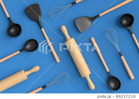 Wooden kitchen utensils, tools and equipment on blue background. Wooden kitchen utensils, tools and equipment on blue background. 89237210