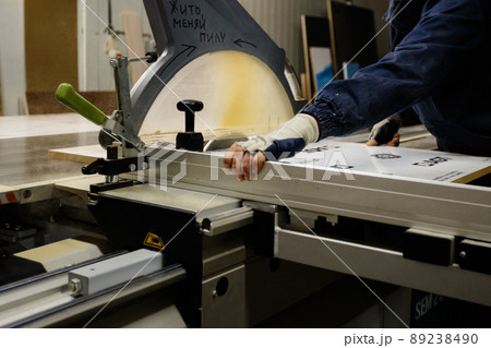 Woodwork and furniture making concept. A carpenter in the workshop doing joinery 89238490